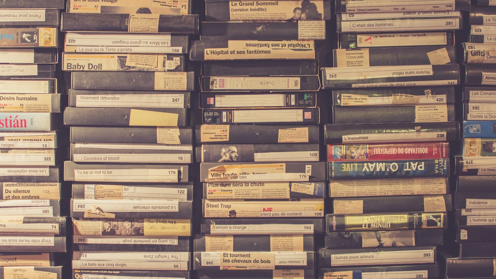 Stacks of old labelled VHS tapes